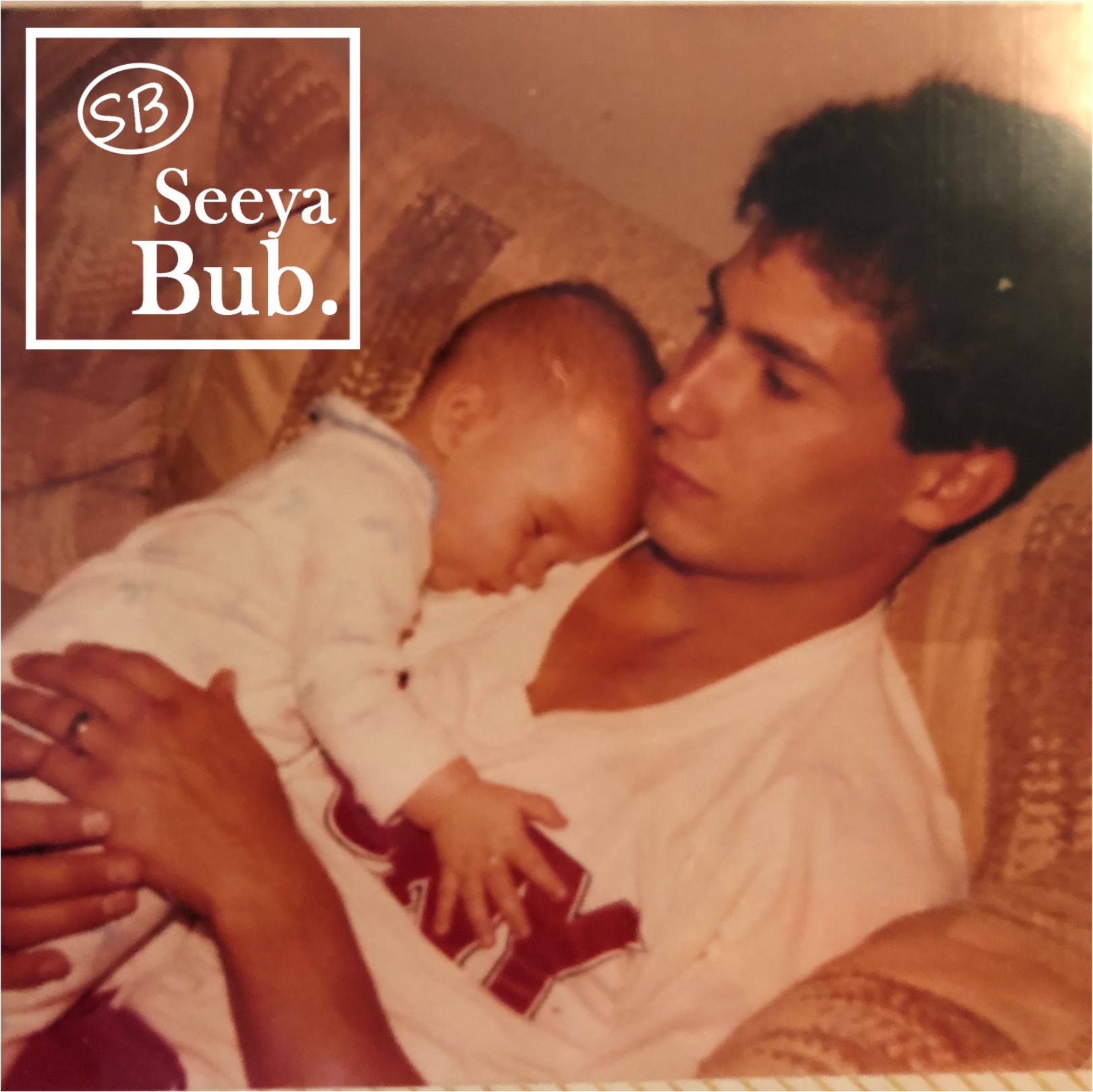 Dad Holding Me as a Baby with SB Logo
